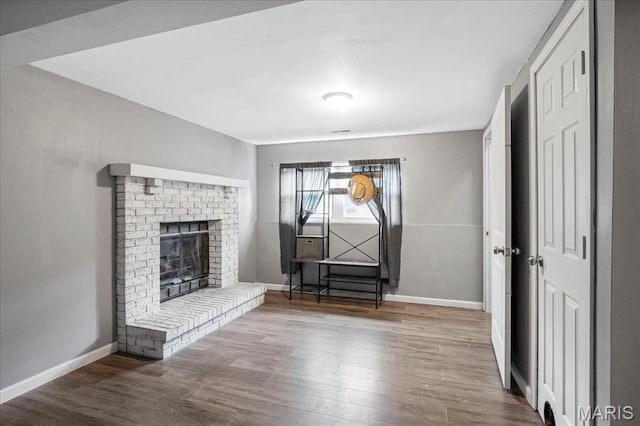 5553 Oak Pointe Dr, Imperial, MO 63052 - unfurnished living room featuring wood finished floors and a fireplace