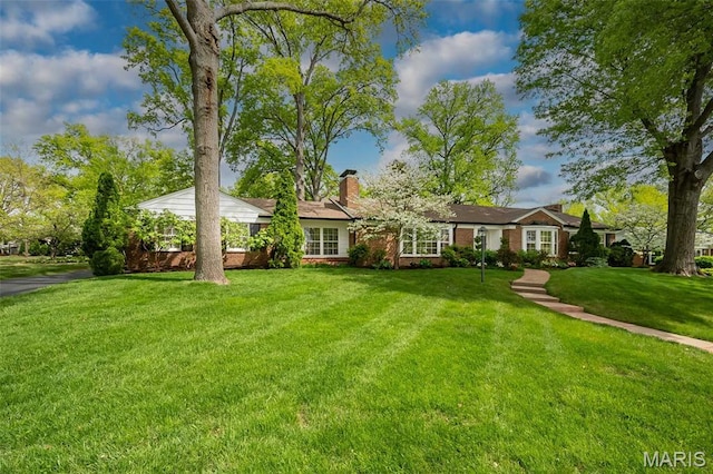 15 York Hills Dr, Saint Louis, MO 63144 - ranch-style house with a front lawn and a chimney