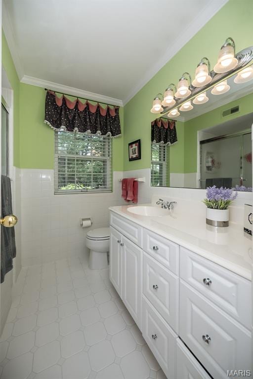15 York Hills Dr, Saint Louis, MO 63144 - bathroom with tile walls, crown molding, a stall shower, toilet, and vanity