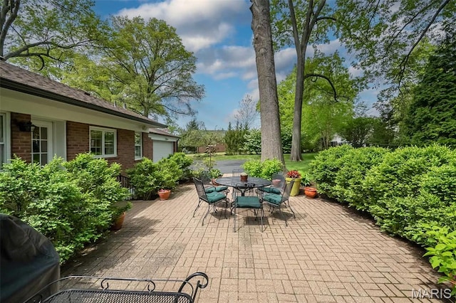 15 York Hills Dr, Saint Louis, MO 63144 - view of patio featuring outdoor dining area and a grill
