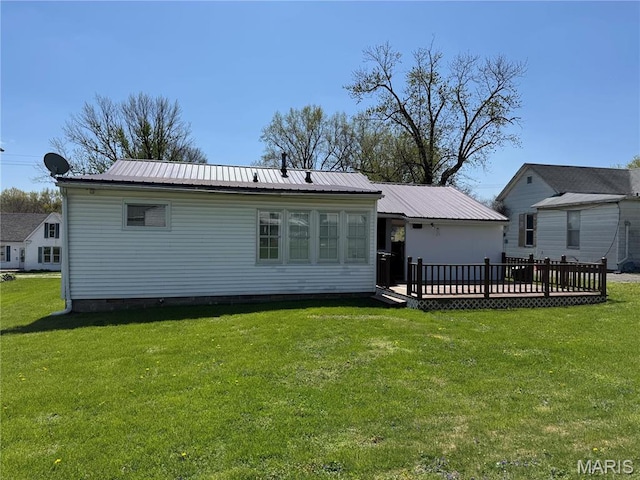 503 Frankford Rd, Louisiana, MO 63353 - rear view of property with crawl space, a yard, metal roof, and a wooden deck
