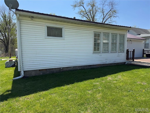 503 Frankford Rd, Louisiana, MO 63353 - view of home's exterior featuring crawl space, a deck, and a lawn