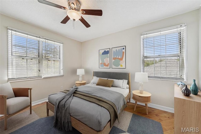 1521 Oriole Ln, Brentwood, MO 63144 - bedroom featuring baseboards, wood finished floors, and a ceiling fan