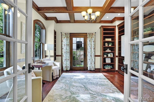 1201 Dolman St, Saint Louis, MO 63104 - entrance foyer featuring french doors, dark wood-type flooring, a chandelier, coffered ceiling, and beamed ceiling