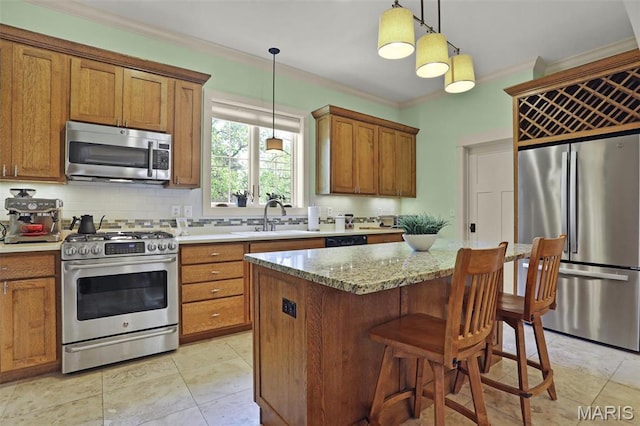 1201 Dolman St, Saint Louis, MO 63104 - kitchen featuring appliances with stainless steel finishes, a sink, brown cabinets, crown molding, and backsplash
