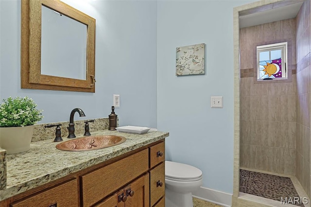 1201 Dolman St, Saint Louis, MO 63104 - full bath with vanity, toilet, tiled shower, and baseboards