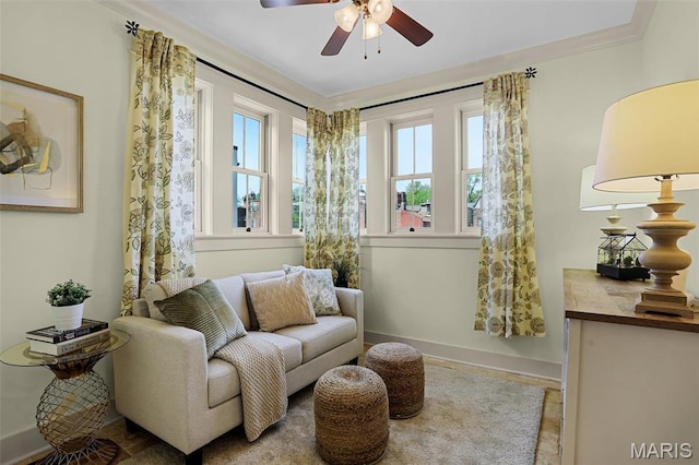 1201 Dolman St, Saint Louis, MO 63104 - living area featuring ceiling fan, baseboards, and ornamental molding