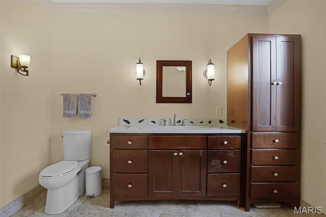 1201 Dolman St, Saint Louis, MO 63104 - bathroom featuring toilet, vanity, and baseboards
