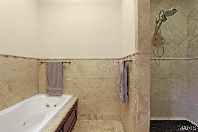 1201 Dolman St, Saint Louis, MO 63104 - full bath featuring a tile shower, a jetted tub, tile walls, and a wainscoted wall
