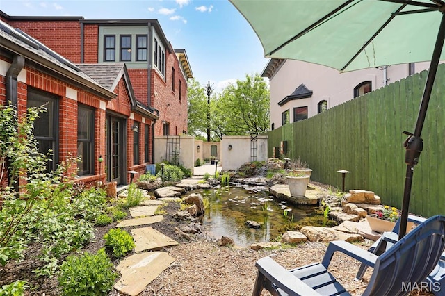 1201 Dolman St, Saint Louis, MO 63104 - view of yard with a small pond