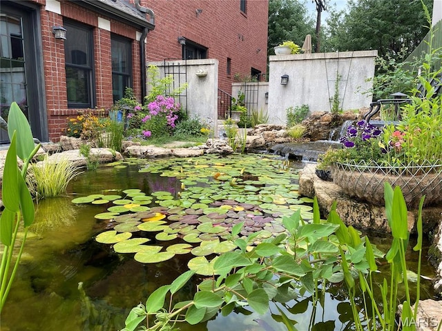 1201 Dolman St, Saint Louis, MO 63104 - view of yard featuring a garden pond