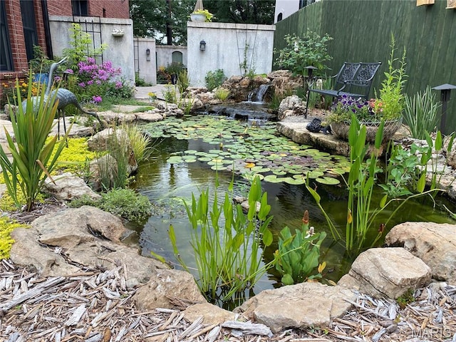 1201 Dolman St, Saint Louis, MO 63104 - view of yard featuring a garden pond