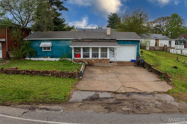 516 N Old Edwardsville Rd, Roxana, IL 62084 - single story home featuring a garage, a sunroom, a shingled roof, driveway, and a chimney