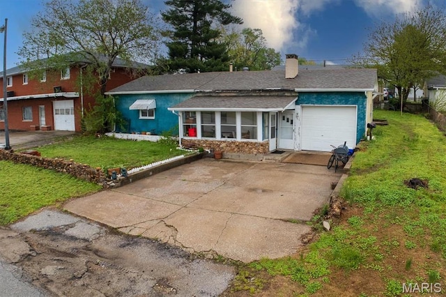 516 N Old Edwardsville Rd, Roxana, IL 62084 - single story home with a shingled roof, a front yard, a garage, a chimney, and driveway