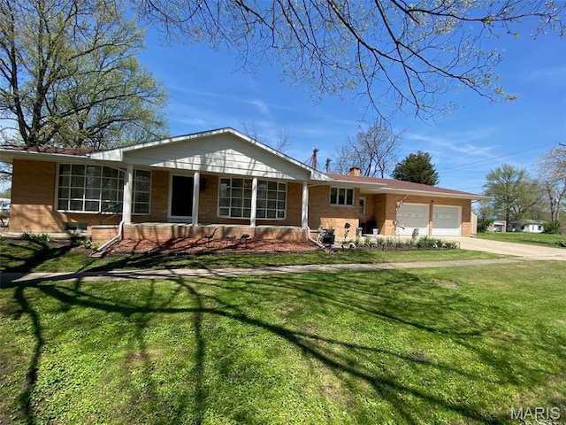 123 S Oak St, Nokomis, IL 62075 - single story home with brick siding, a garage, and a front yard