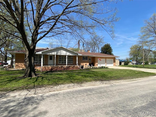 123 S Oak St, Nokomis, IL 62075 - ranch-style home featuring driveway, an attached garage, a chimney, and a front yard