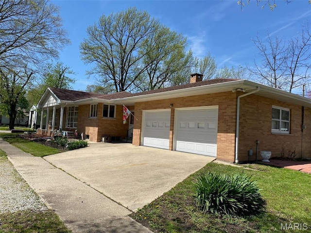 123 S Oak St, Nokomis, IL 62075 - single story home featuring brick siding, a garage, concrete driveway, and a chimney
