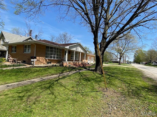 123 S Oak St, Nokomis, IL 62075 - ranch-style house featuring brick siding, a front lawn, and a porch