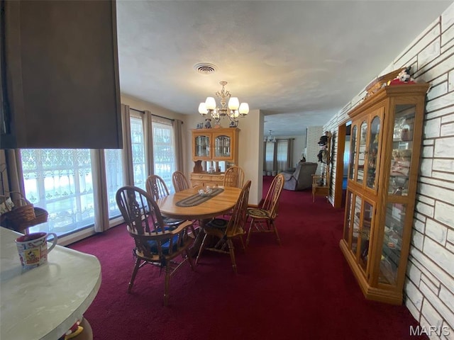 123 S Oak St, Nokomis, IL 62075 - dining area with carpet and a chandelier