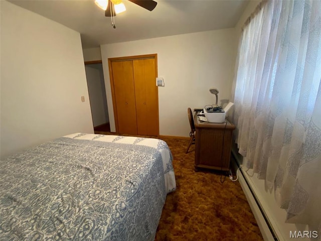 123 S Oak St, Nokomis, IL 62075 - carpeted bedroom with a baseboard radiator and a ceiling fan