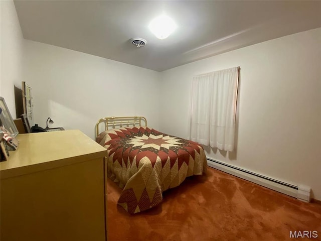 123 S Oak St, Nokomis, IL 62075 - carpeted bedroom with a baseboard heating unit