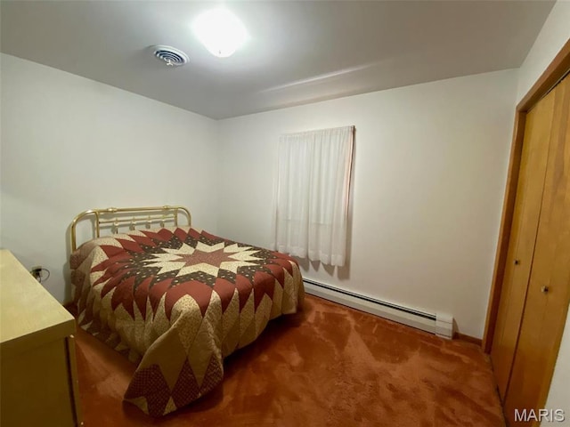 123 S Oak St, Nokomis, IL 62075 - bedroom featuring a baseboard heating unit, carpet, and a closet