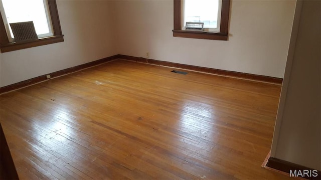 340 Kemper St, Troy, MO 63379 - unfurnished room featuring plenty of natural light, hardwood / wood-style flooring, and baseboards