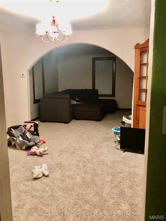 340 Kemper St, Troy, MO 63379 - interior space with arched walkways, a chandelier, and carpet