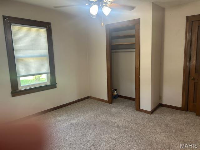 340 Kemper St, Troy, MO 63379 - unfurnished bedroom featuring light colored carpet, a closet, and a ceiling fan