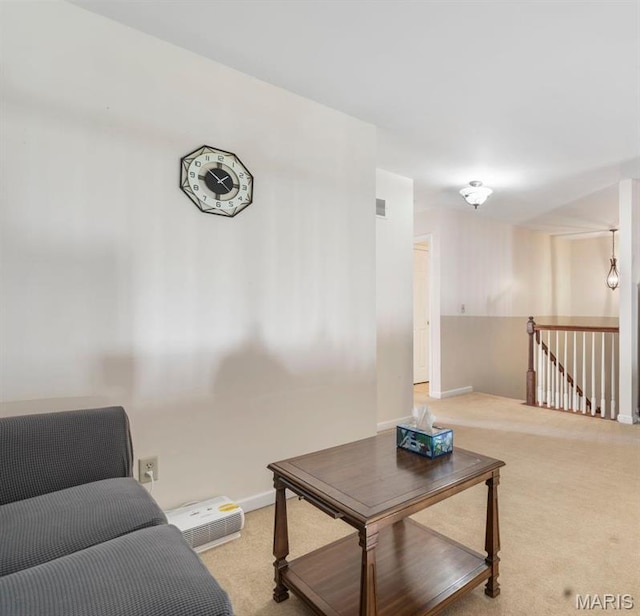 627 Rosetta Dr Unit M1, Florissant, MO 63031 - carpeted living room featuring baseboards