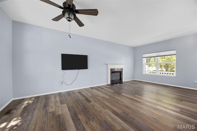 416 Briarchase Pl, Lake St Louis, MO 63367 - unfurnished living room with wood finished floors, a high end fireplace, baseboards, and a ceiling fan