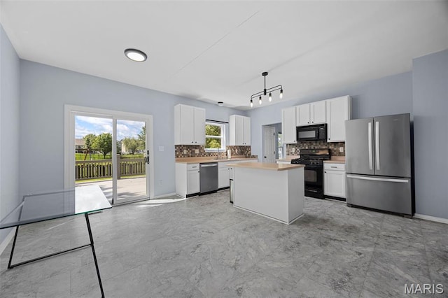 416 Briarchase Pl, Lake St Louis, MO 63367 - kitchen with black appliances, tasteful backsplash, white cabinets, light countertops, and a kitchen island