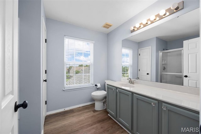 416 Briarchase Pl, Lake St Louis, MO 63367 - bathroom with a shower stall, baseboards, vanity, wood finished floors, and toilet