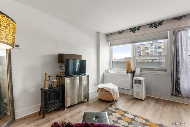living area featuring wood finished floors and baseboards