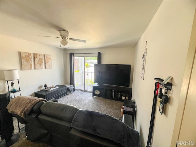 carpeted living room with ceiling fan