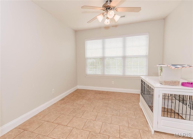140 Vernon St, Saint Robert, MO 65584 - spare room with a ceiling fan, baseboards, and light tile patterned floors