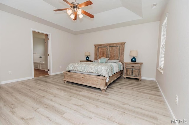 140 Vernon St, Saint Robert, MO 65584 - bedroom with a raised ceiling, light wood finished floors, and multiple windows