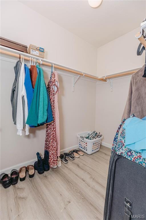 140 Vernon St, Saint Robert, MO 65584 - walk in closet featuring wood finished floors