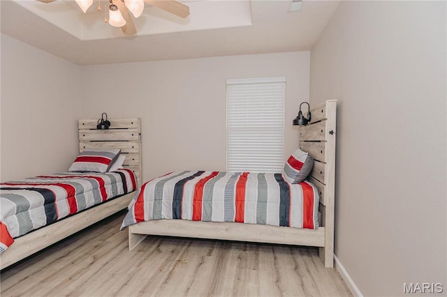 140 Vernon St, Saint Robert, MO 65584 - bedroom with wood finished floors and a ceiling fan