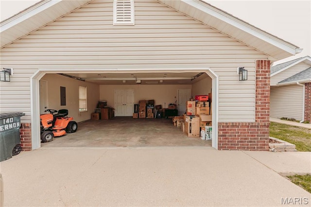 140 Vernon St, Saint Robert, MO 65584 - garage with electric panel and concrete driveway