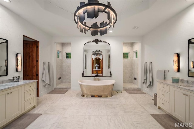 544 Quail Ridge Ln, Saint Albans, MO 63073 - full bath with a walk in shower, a soaking tub, a raised ceiling, recessed lighting, and two vanities