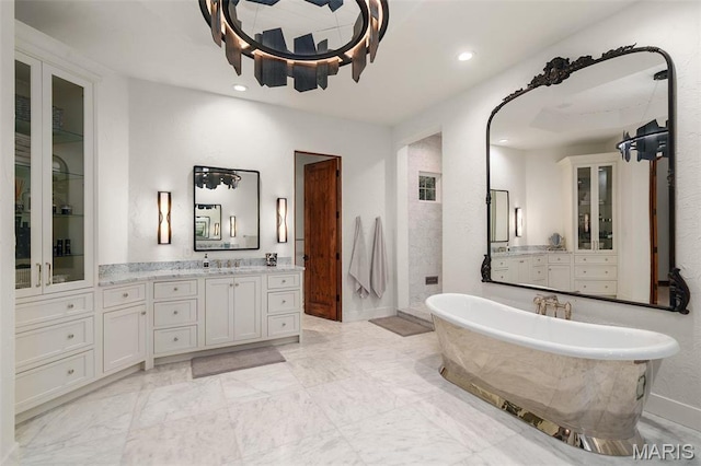544 Quail Ridge Ln, Saint Albans, MO 63073 - bathroom featuring a freestanding tub, recessed lighting, vanity, marble finish flooring, and walk in shower