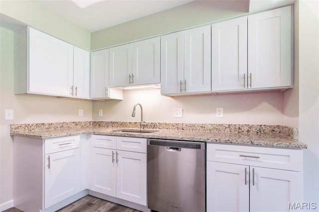 2317 Seven Pines Dr Unit 4, Saint Louis, MO 63146 - kitchen with stainless steel dishwasher, a sink, white cabinets, and wood finished floors