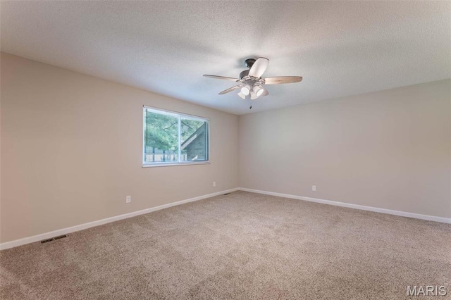 2317 Seven Pines Dr Unit 4, Saint Louis, MO 63146 - unfurnished room with carpet flooring, a ceiling fan, baseboards, and a textured ceiling