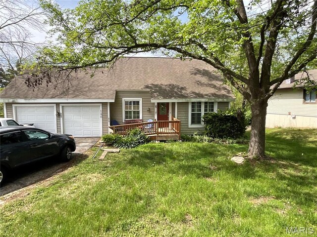 148 Shaw Dr, Eureka, MO 63025 - view of front facade featuring an attached garage, a shingled roof, a front yard, and driveway