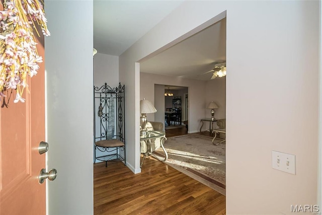 11518 Galba Dr, Florissant, MO 63033 - foyer with wood finished floors, a ceiling fan, and baseboards