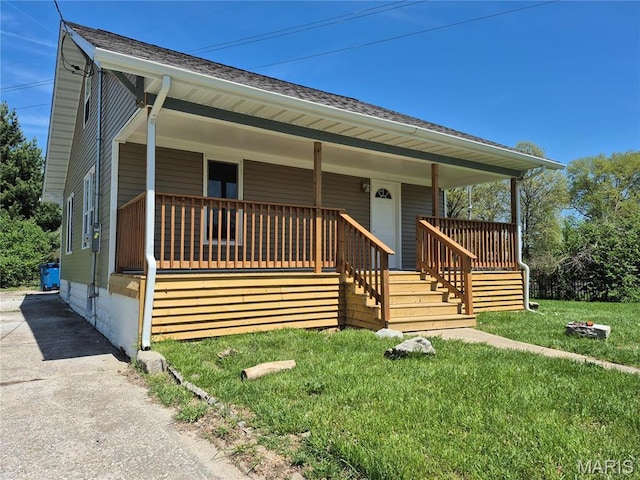 3308 Kendall Ave, Alton, IL 62002 - view of front of home featuring covered porch, a shingled roof, and a front lawn