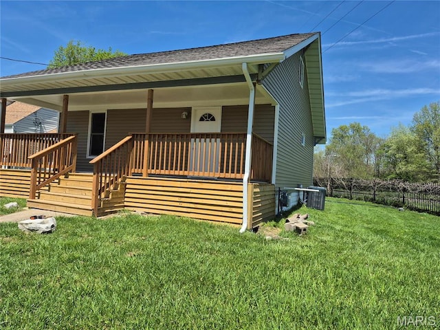 3308 Kendall Ave, Alton, IL 62002 - view of front of property with covered porch, a shingled roof, and central AC