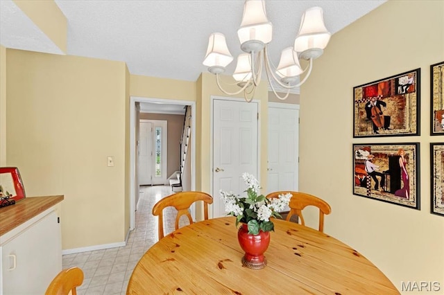 889 Almond Hill Ct, Manchester, MO 63021 - dining space with baseboards and a chandelier