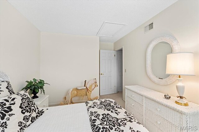 889 Almond Hill Ct, Manchester, MO 63021 - bedroom featuring attic access, light carpet, and a textured ceiling